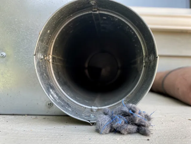 Lake Wylie Dryer Vent Cleaning technician using specialized equipment to clear severe dryer vent blockage in Lake Wylie